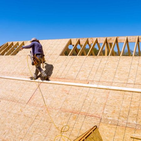 home-roof-construction-applying-roof-plywood-panels-in-new-house.jpg